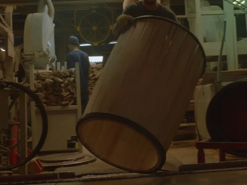 A barrel on the cooperage floor being worked into shape